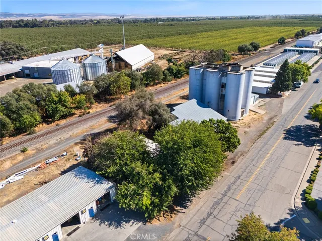 an aerial view of a house with outdoor space