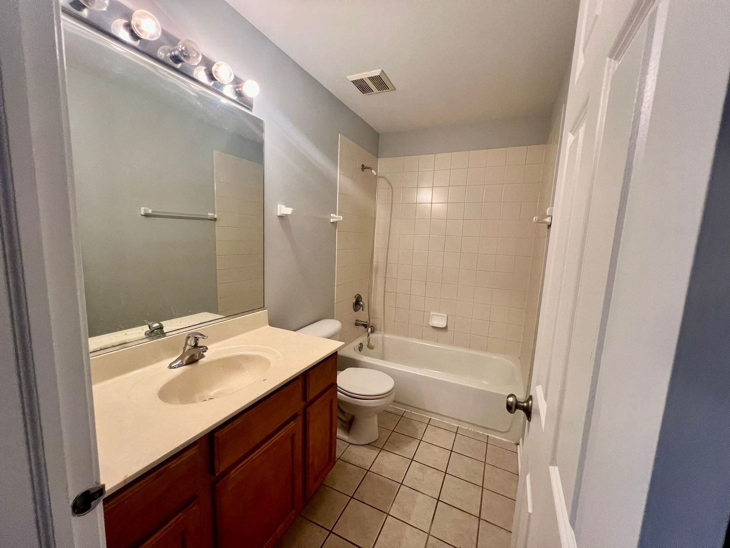 2328 Georgetown Circle Aurora, IL 60503 - Photo 12 of 12 a bathroom with a double vanity sink toilet mirror and shower