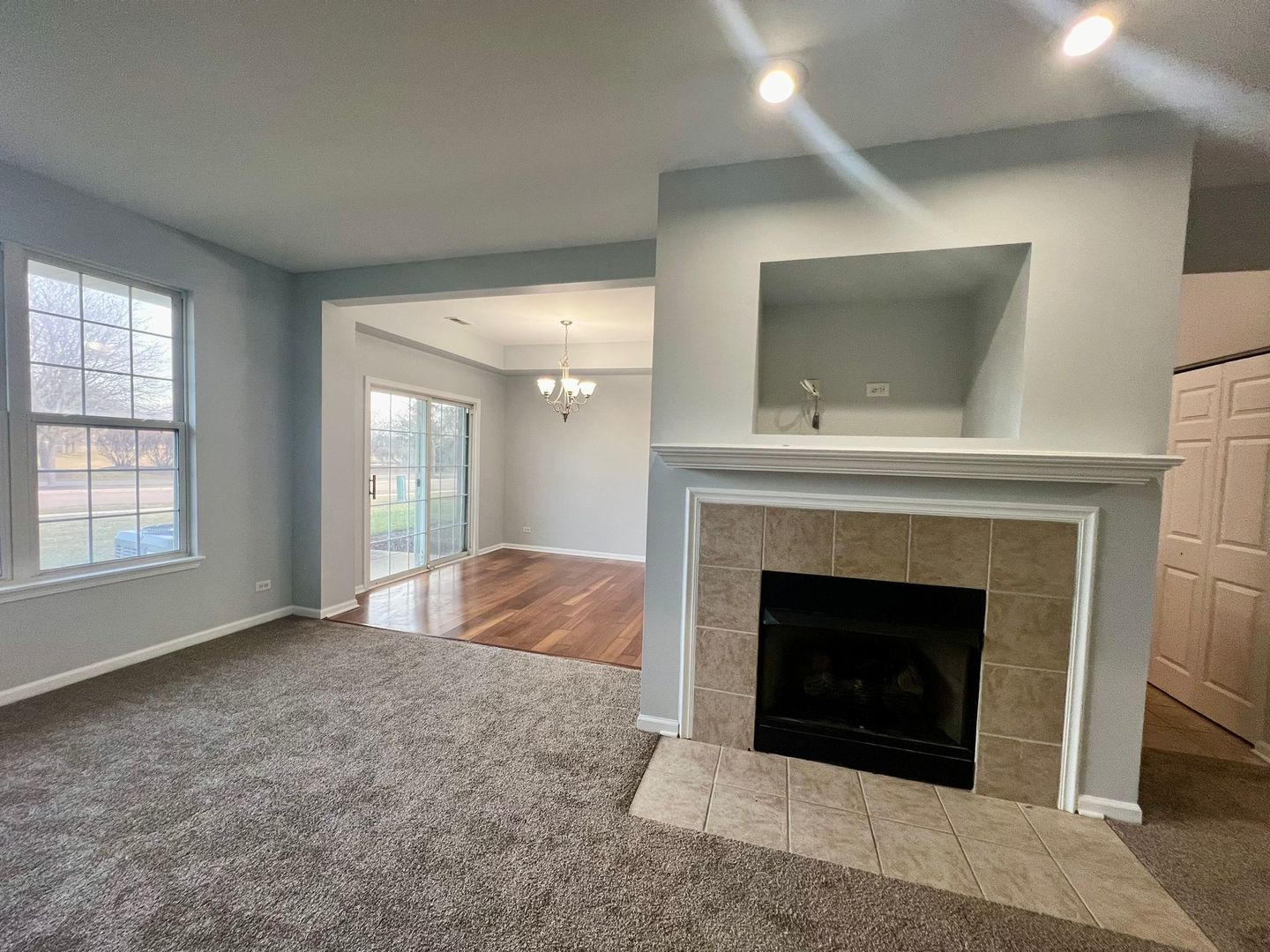 2328 Georgetown Circle Aurora, IL 60503 - Photo 2 of 12 a living room with a fireplace and a fireplace