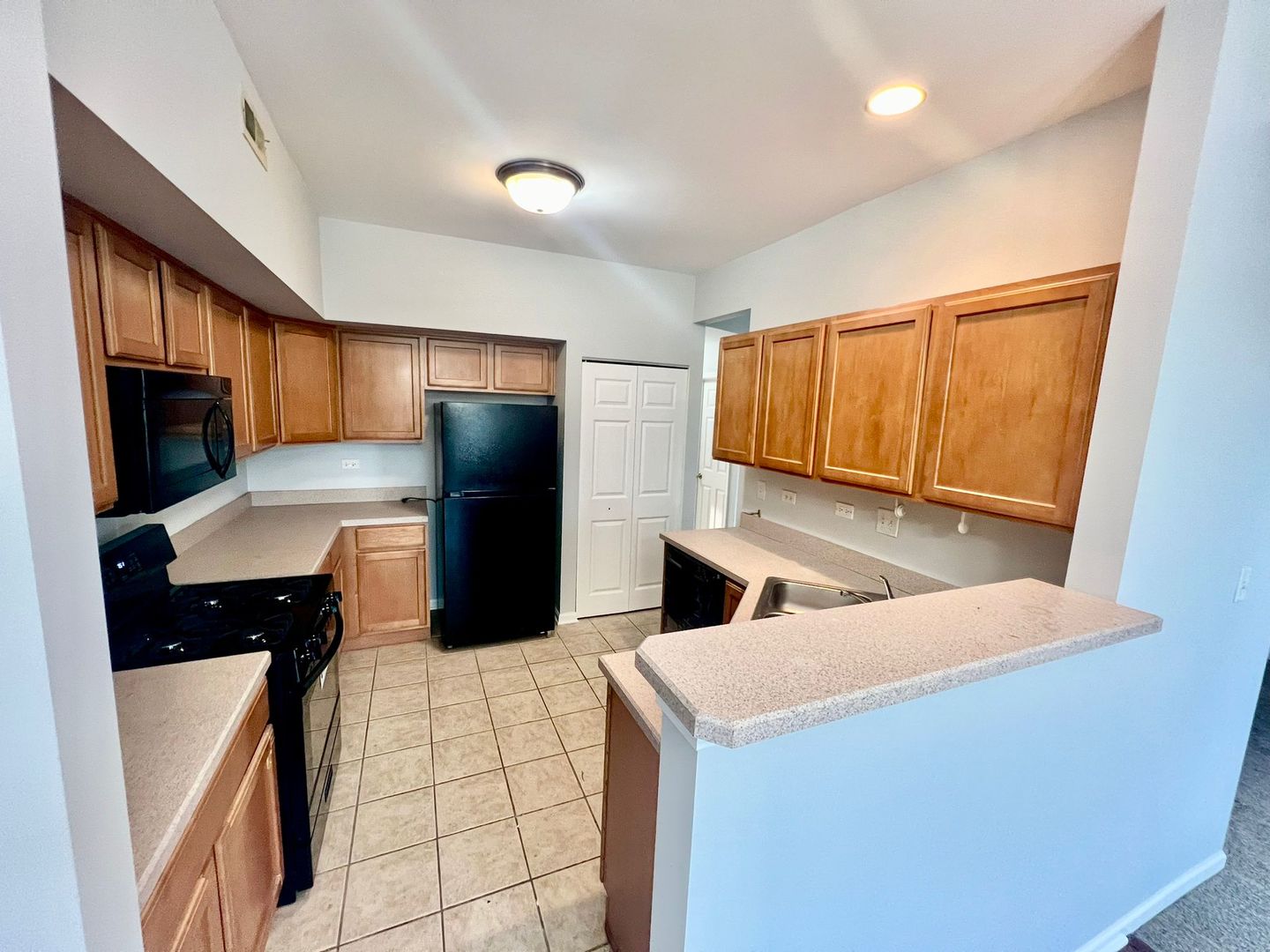 2328 Georgetown Circle Aurora, IL 60503 - Photo 4 of 12 a kitchen with stainless steel appliances a refrigerator and a stove top oven