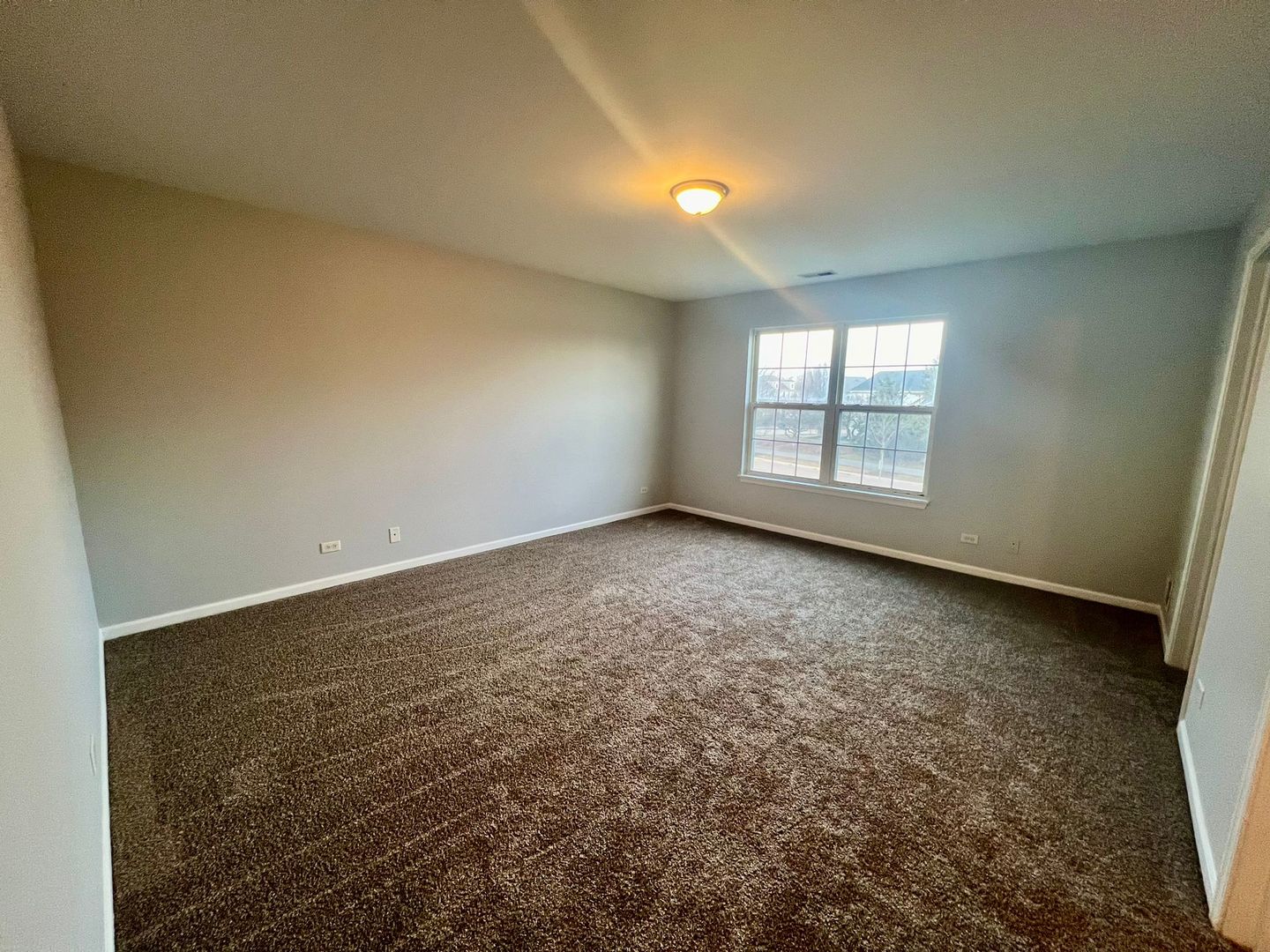 2328 Georgetown Circle Aurora, IL 60503 - Photo 8 of 12 an empty room with windows