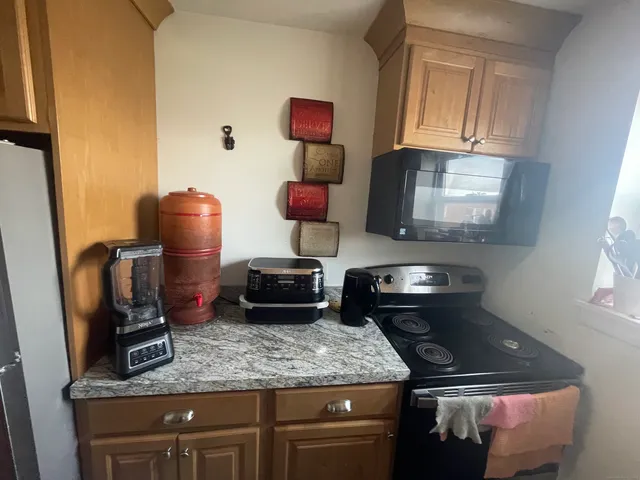 a kitchen with a stove and a microwave