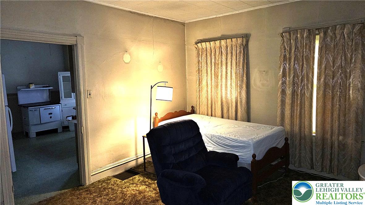 415 Stoneman Street Bethlehem, PA 18015 - Photo 13 of 45 a bedroom with a bed and a dresser