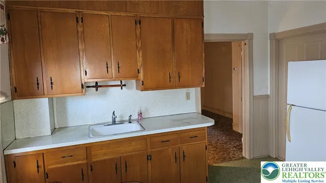 a bedroom with a bed and a hallway