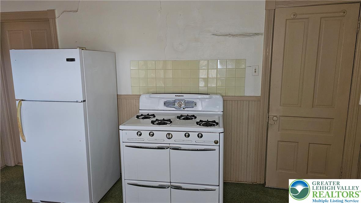 415 Stoneman Street Bethlehem, PA 18015 - Photo 20 of 45 a kitchen with a stove and a refrigerator