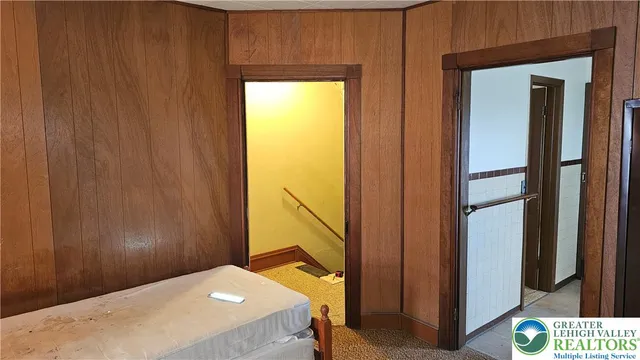 a bathroom with a tub and a mirror