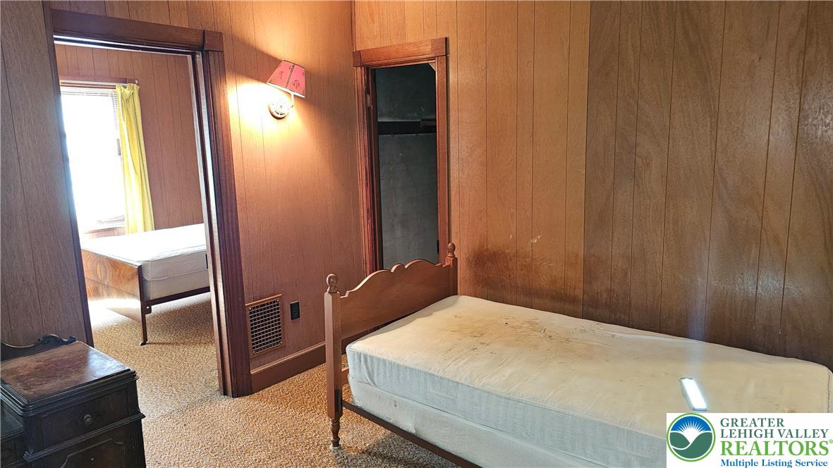 415 Stoneman Street Bethlehem, PA 18015 - Photo 26 of 45 a bedroom with a bed and a mirror