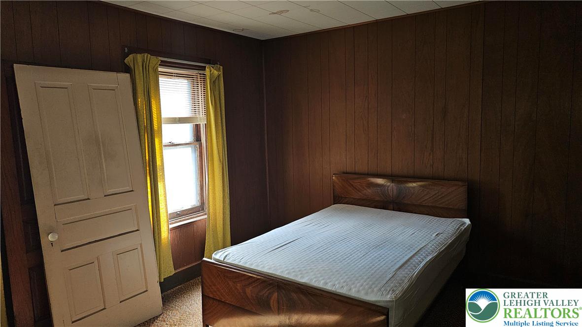 415 Stoneman Street Bethlehem, PA 18015 - Photo 27 of 45 a bedroom with a bed and a window