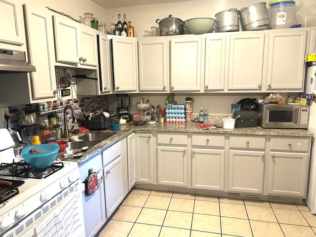 a kitchen with a sink and cabinets