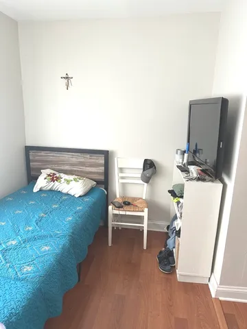 a bed room with a bed and a couch