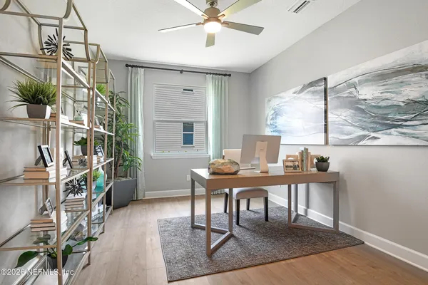 a workspace with furniture and a window