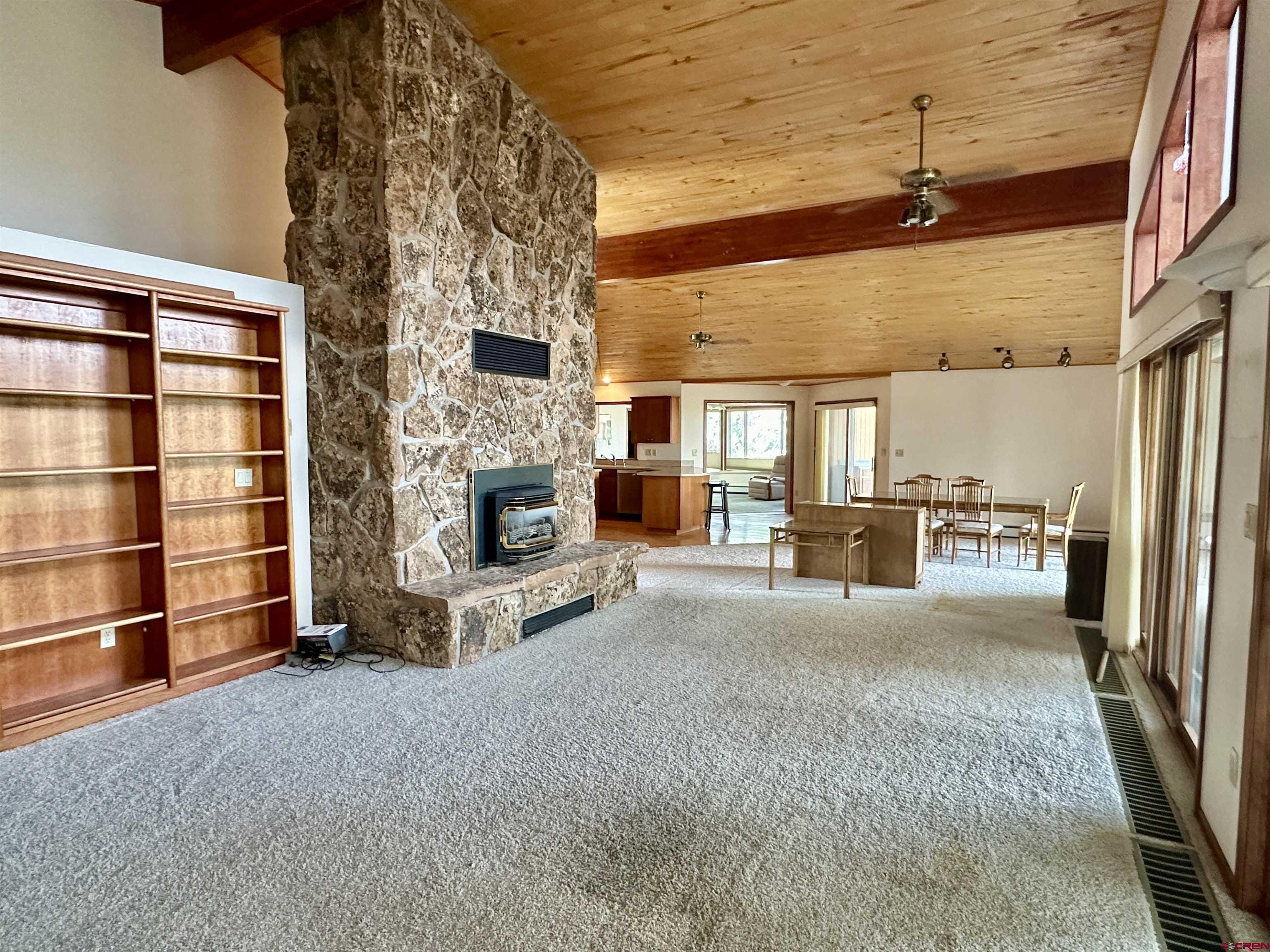 14581 Deer Run Road Delta, CO 81416 - Photo 17 of 35 a living room with furniture and a fireplace