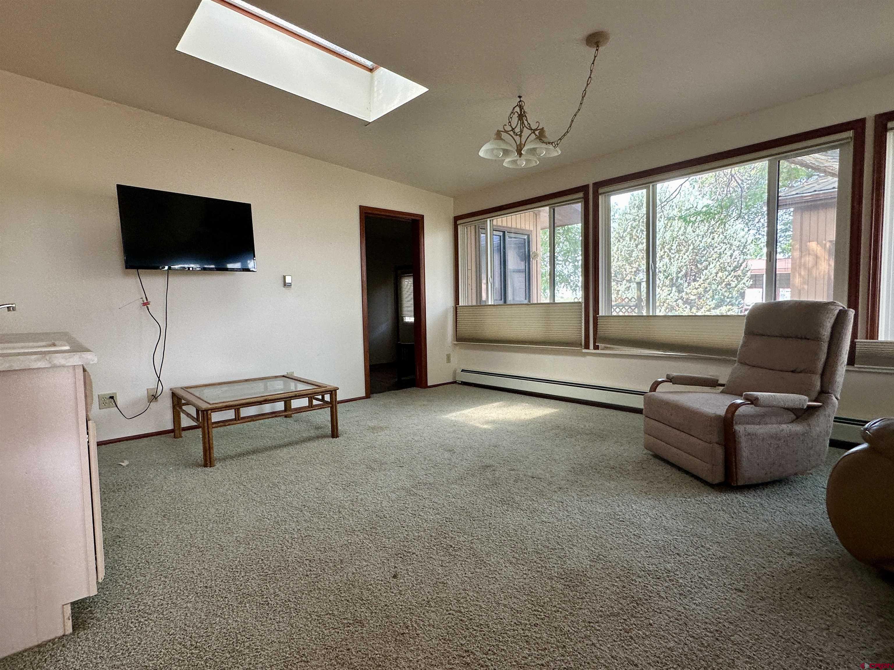 14581 Deer Run Road Delta, CO 81416 - Photo 20 of 35 a living room with furniture and a flat screen tv