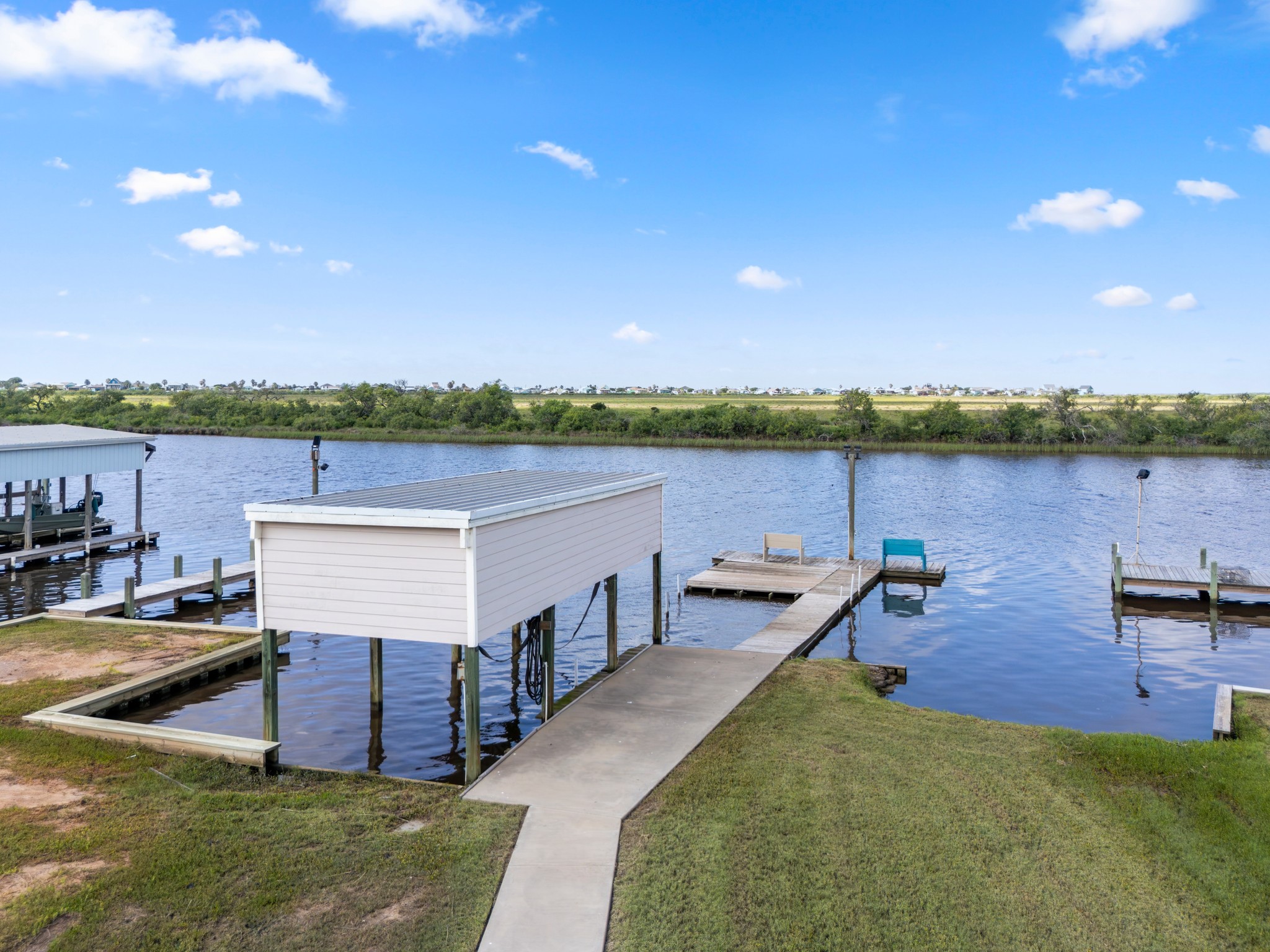 124 Seagull Road Sargent, TX 77414 - Photo 34 of 49 Standing on dock with sunset near