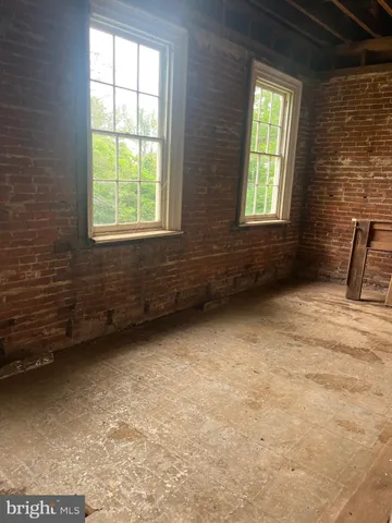 a view of balcony with furniture