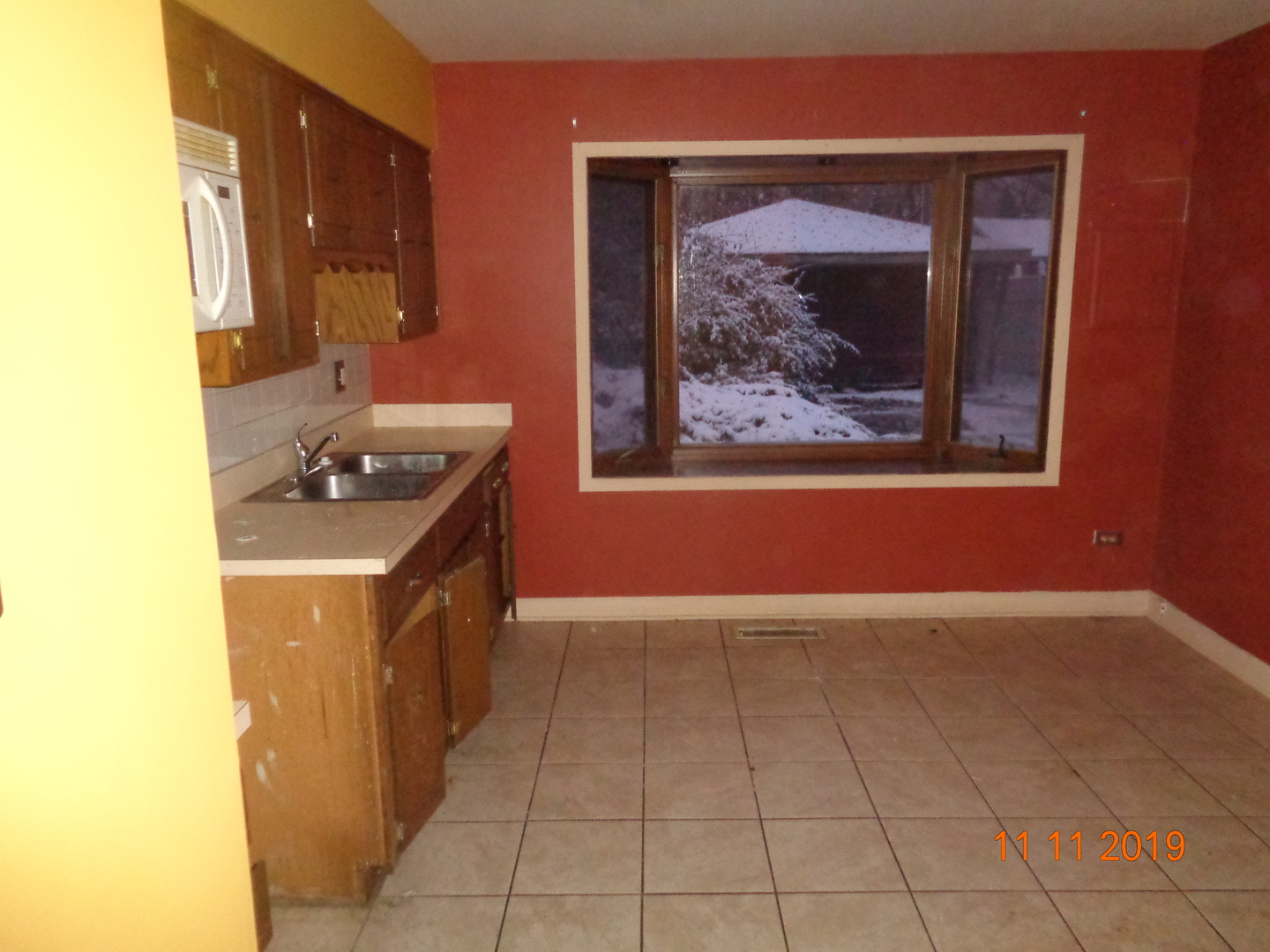 17331 Community Street Lansing, IL 60438 - Photo 8 of 9 a view of a bathroom with a sink and a mirror