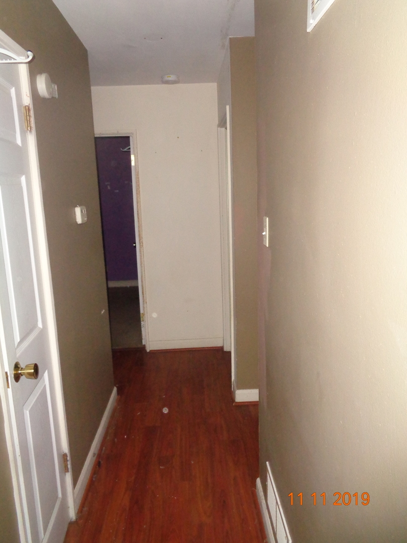 17331 Community Street Lansing, IL 60438 - Photo 9 of 9 a view of hallway with wooden floor