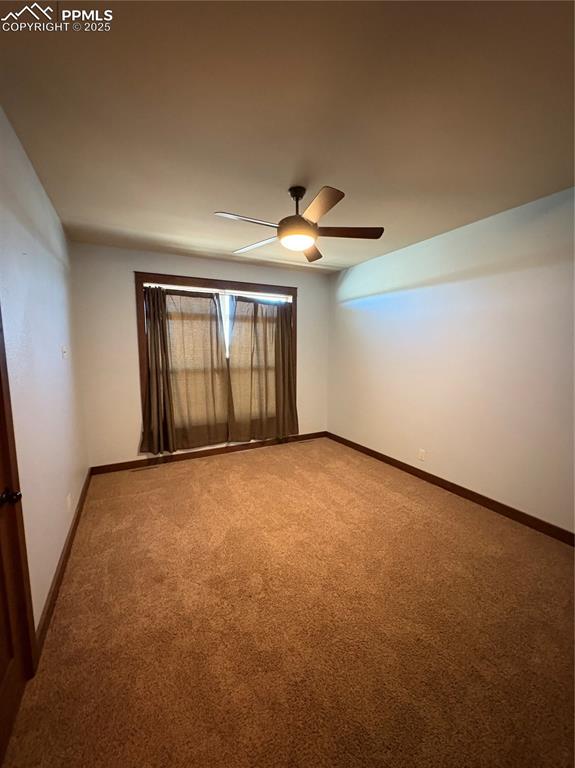 1925 Doe Valley Road Guffey, CO 80820 - Photo 14 of 30 an empty room with a empty space and windows