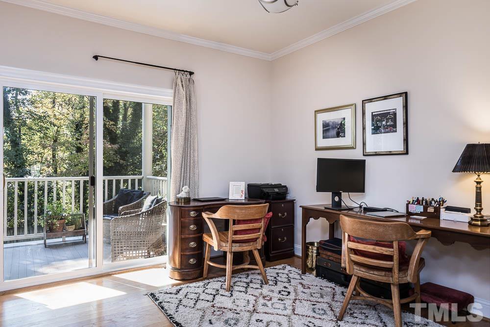 100 Edenburgh Road, Unit 203 Raleigh, NC 27608 - Photo 13 of 26 a reading room with furniture and a floor to ceiling window