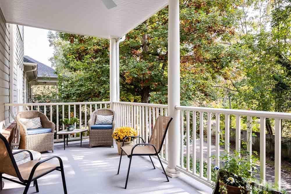 100 Edenburgh Road, Unit 203 Raleigh, NC 27608 - Photo 14 of 26 a view of a chair and tables in the balcony