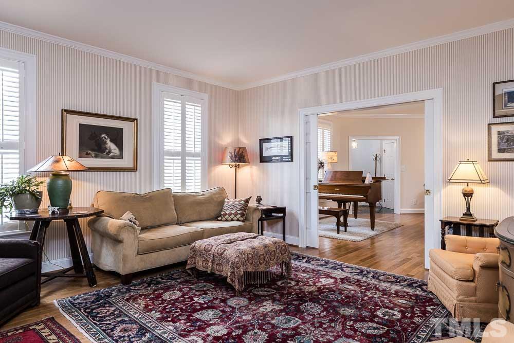 100 Edenburgh Road, Unit 203 Raleigh, NC 27608 - Photo 17 of 26 a living room with furniture and a couch