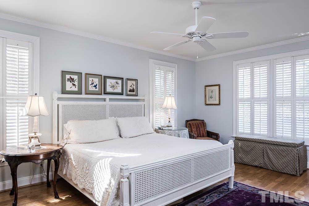 100 Edenburgh Road, Unit 203 Raleigh, NC 27608 - Photo 18 of 26 a bedroom with a large bed and a window