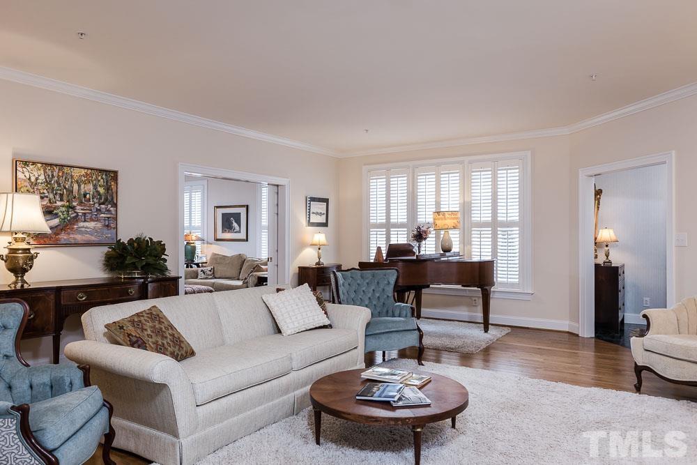100 Edenburgh Road, Unit 203 Raleigh, NC 27608 - Photo 6 of 26 a living room with furniture and a wooden floor