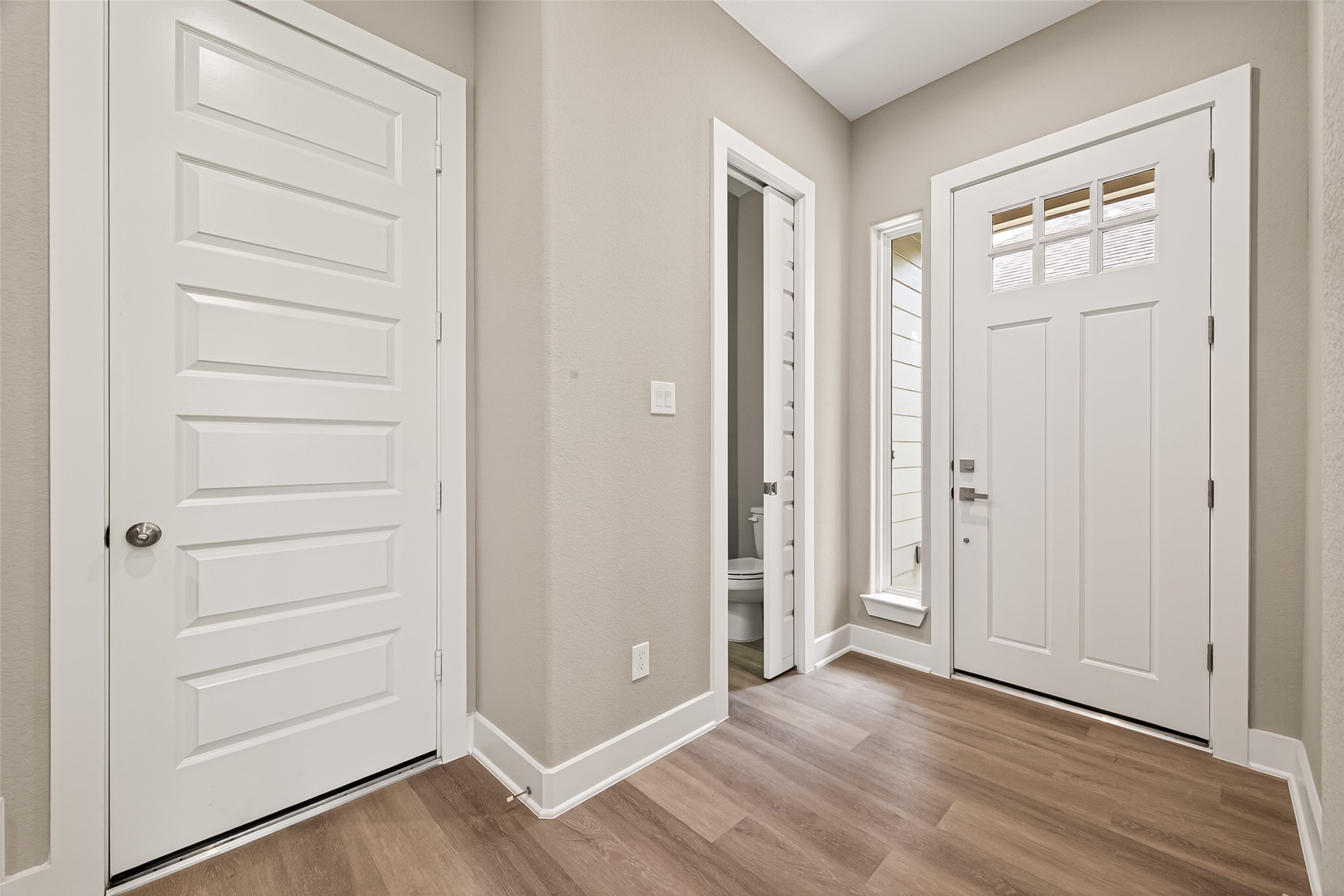 3514 Runnels Street, Unit B Houston, TX 77003 - Photo 11 of 39 Just inside the front door. The half bath is here (see the pocket door on the right). And the door on the left goes to the attached 2-car garage.