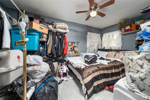 a bedroom with bed and a walk in closet