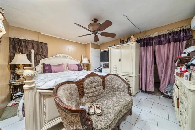 a bedroom with a bed and a mirror