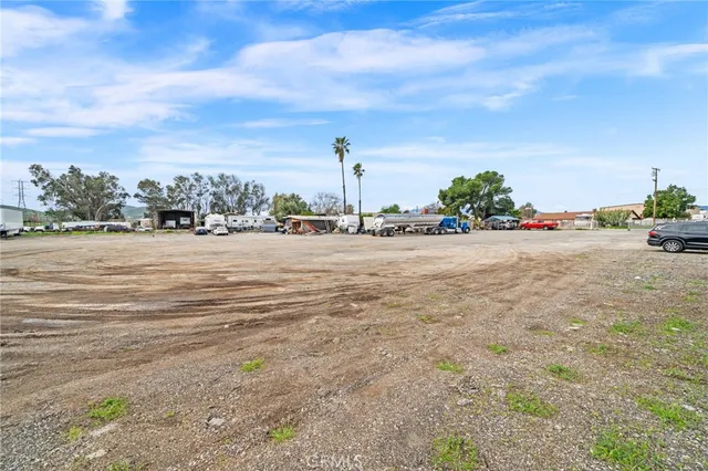 an aerial view of a house with a yard and a garage
