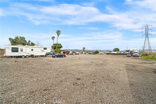 an aerial view of a multi story residential apartment building with a yard