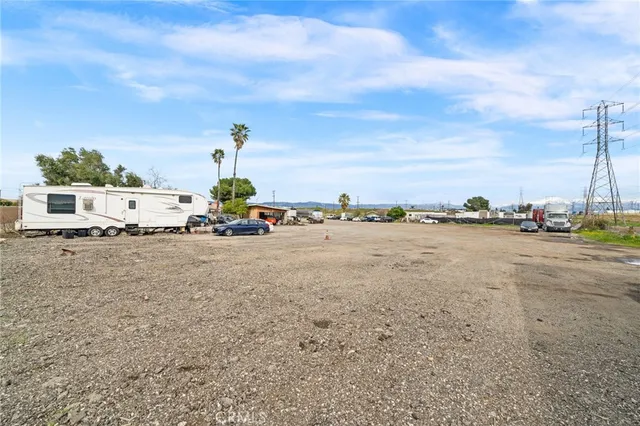 an aerial view of a multi story residential apartment building with a yard