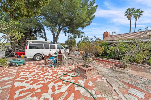 a view of a car park in front of a house