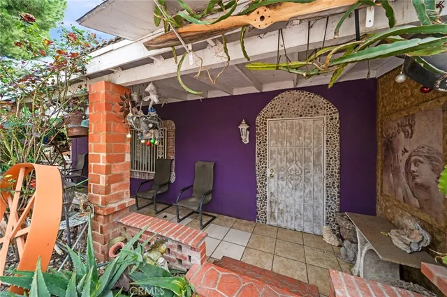 a view of a chairs and table in a patio