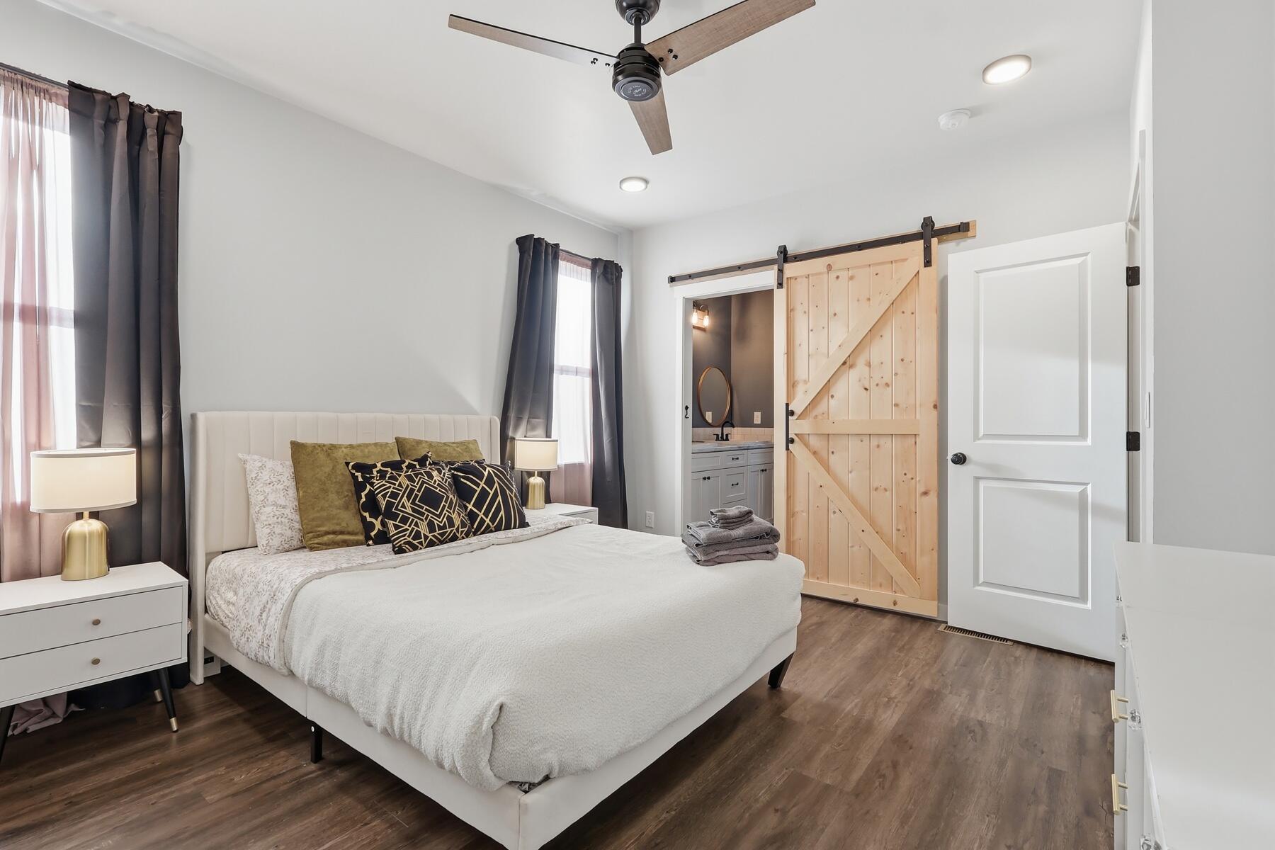16455 Bassett Road La Pine, OR 97739 - Photo 13 of 44 a bedroom with a bed and a chandelier