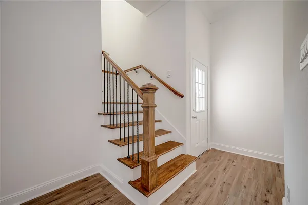 a view of entryway with wooden floor