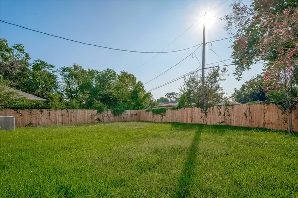 a view of a yard with a fence