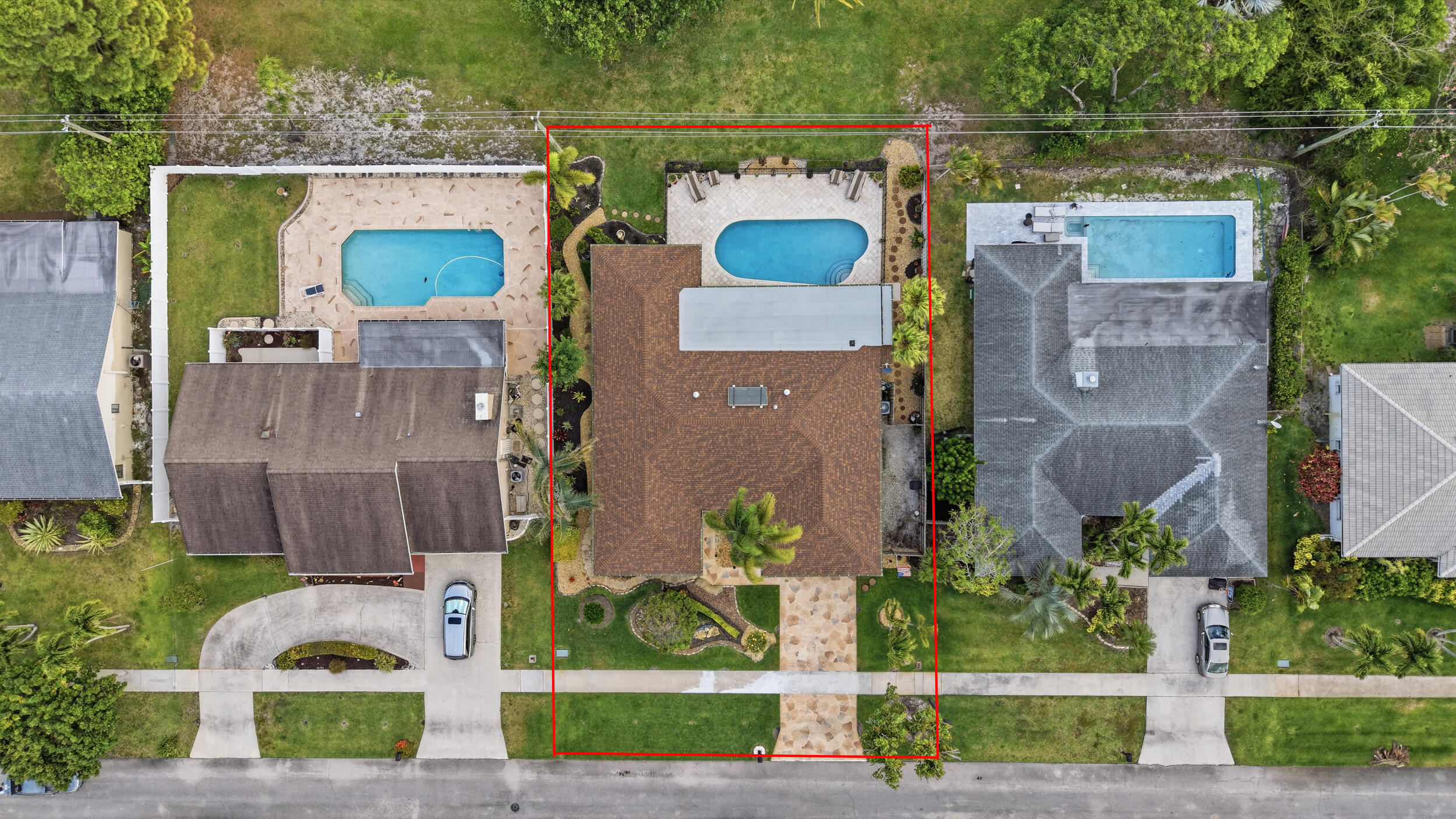 4780 Brandywine Drive Boca Raton, FL 33487 - Photo 38 of 43 a front view of a house with a garden