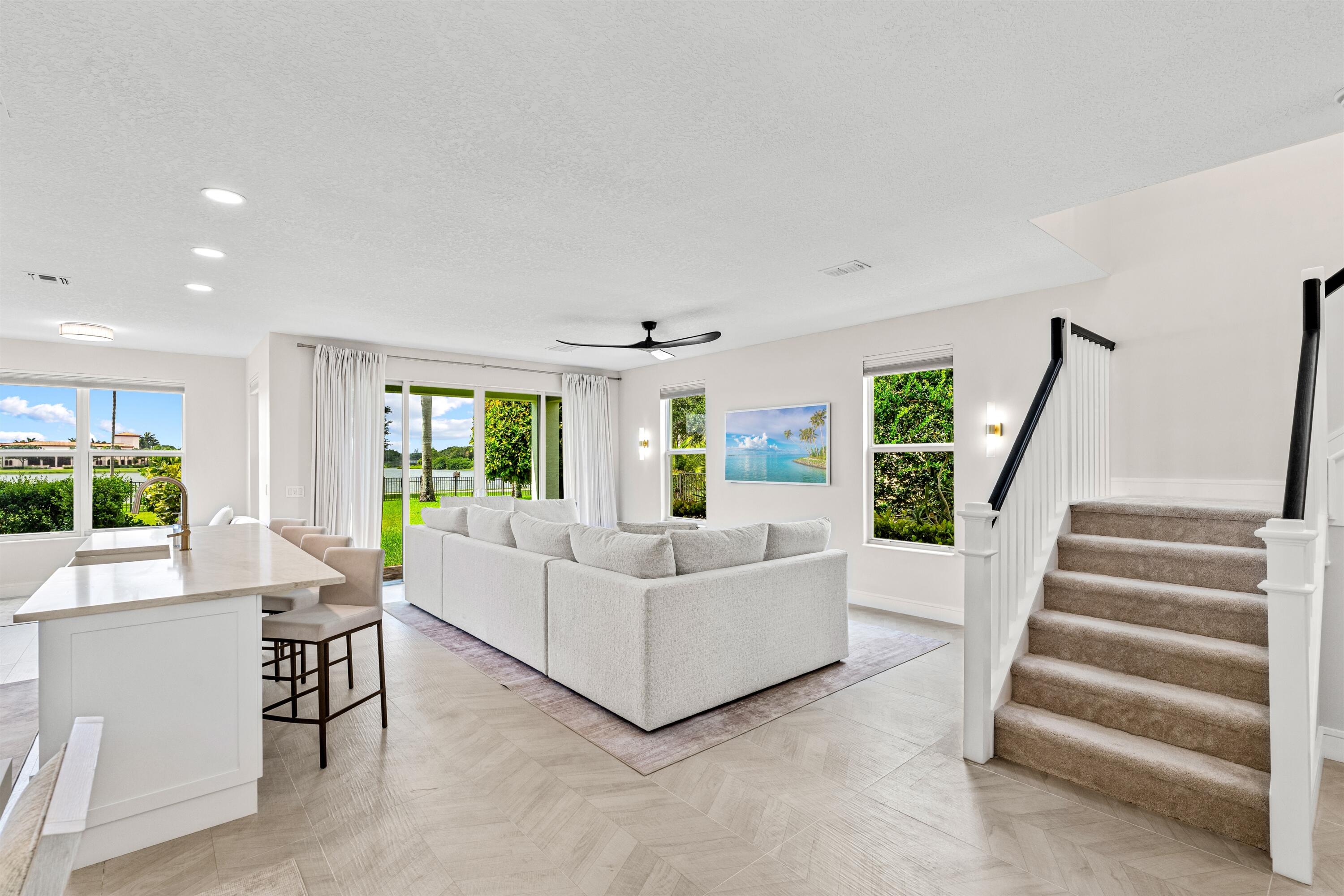 1570 Northwest 48th Place Boca Raton, FL 33431 - Photo 12 of 30 a living room with furniture and a large window