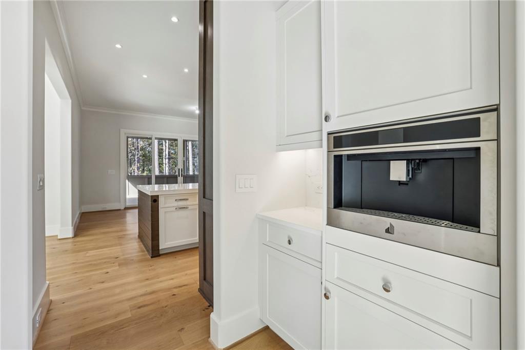 825 Kenry Court Atlanta, GA 30342 - Photo 13 of 50 a living room with wooden floor and flat screen tv