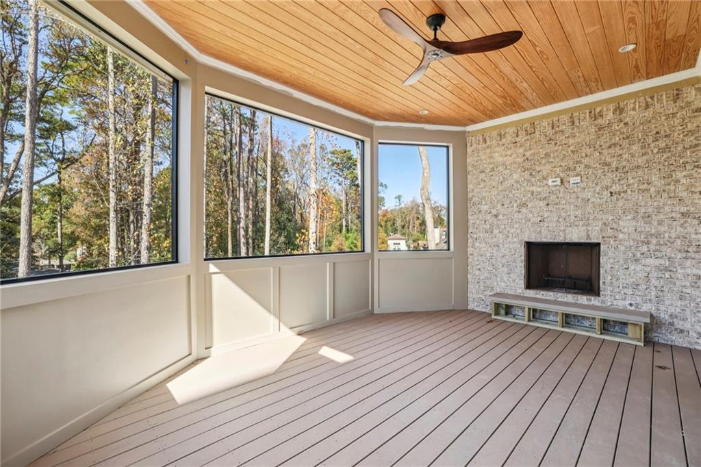 825 Kenry Court Atlanta, GA 30342 - Photo 14 of 50 a view of an empty room with wooden floor and a window
