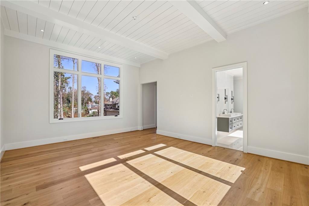 825 Kenry Court Atlanta, GA 30342 - Photo 17 of 50 a view of an empty room with window and wooden floor