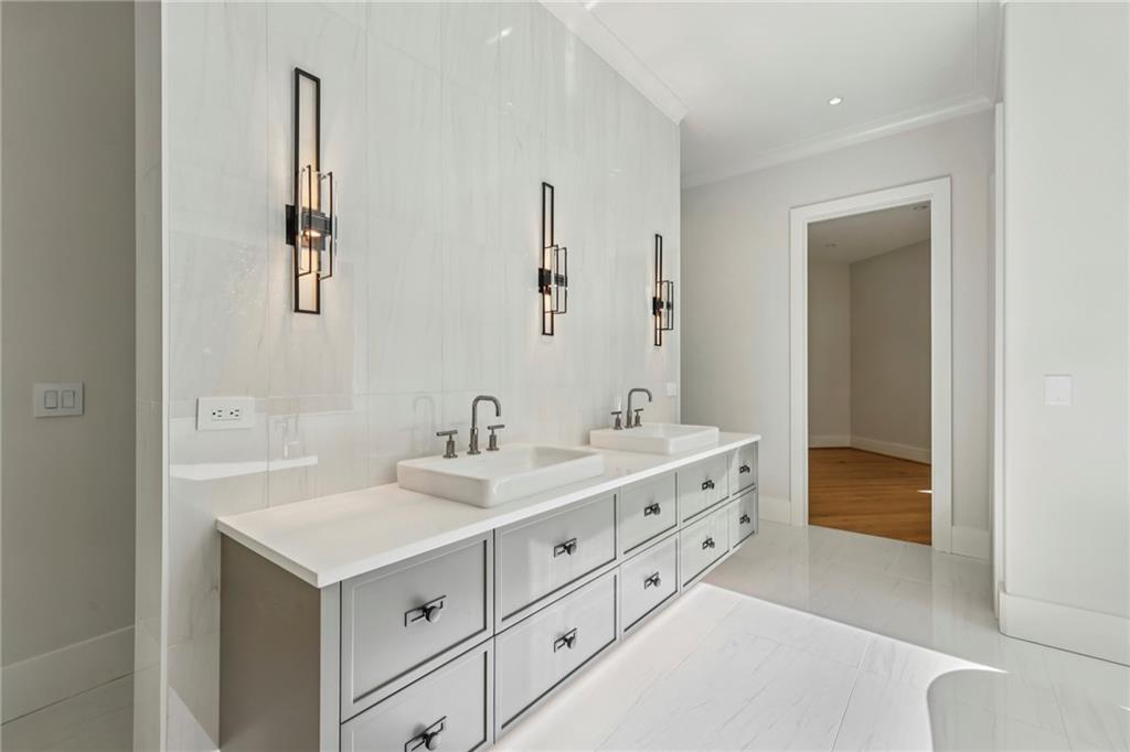 825 Kenry Court Atlanta, GA 30342 - Photo 21 of 50 a bathroom with 2 sink and a mirror