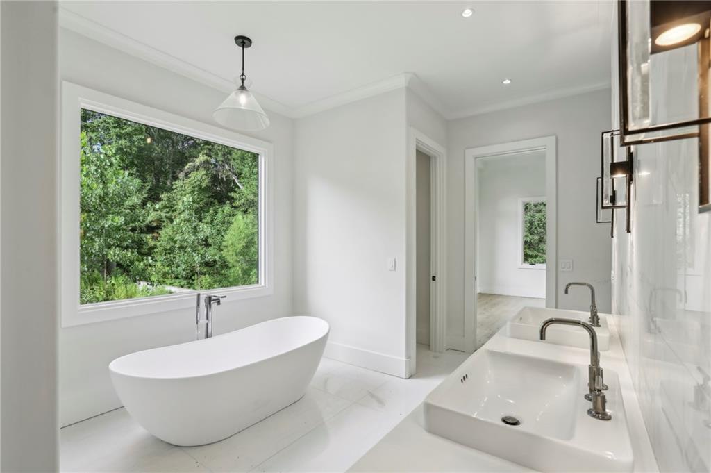 825 Kenry Court Atlanta, GA 30342 - Photo 23 of 50 a bathroom with a sink and a bathtub