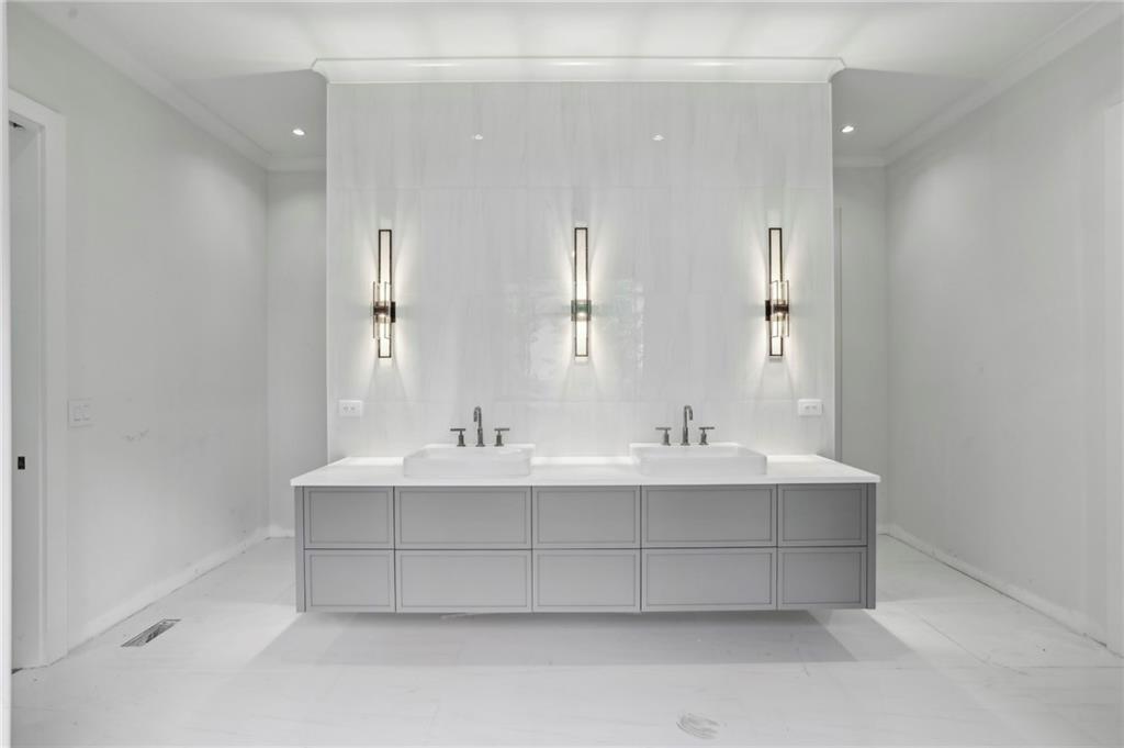 825 Kenry Court Atlanta, GA 30342 - Photo 25 of 50 a bathroom with a sink and a mirror