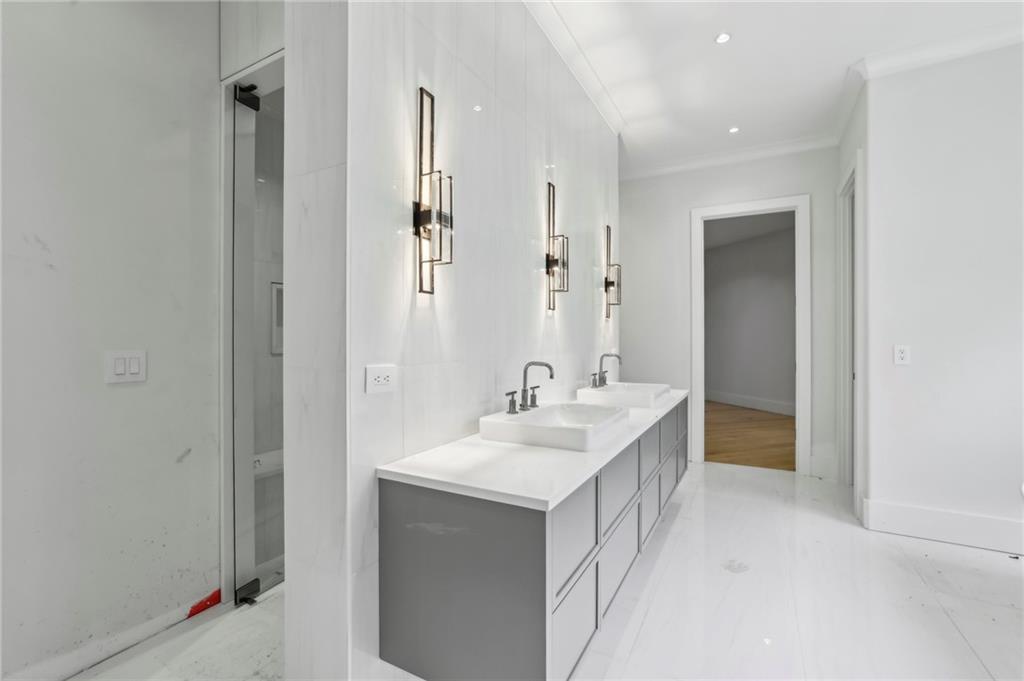 825 Kenry Court Atlanta, GA 30342 - Photo 26 of 50 a bathroom with a sink and a mirror