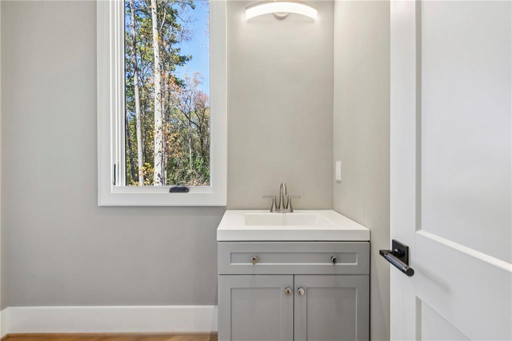 825 Kenry Court Atlanta, GA 30342 - Photo 50 of 50 a bathroom with a sink and a mirror