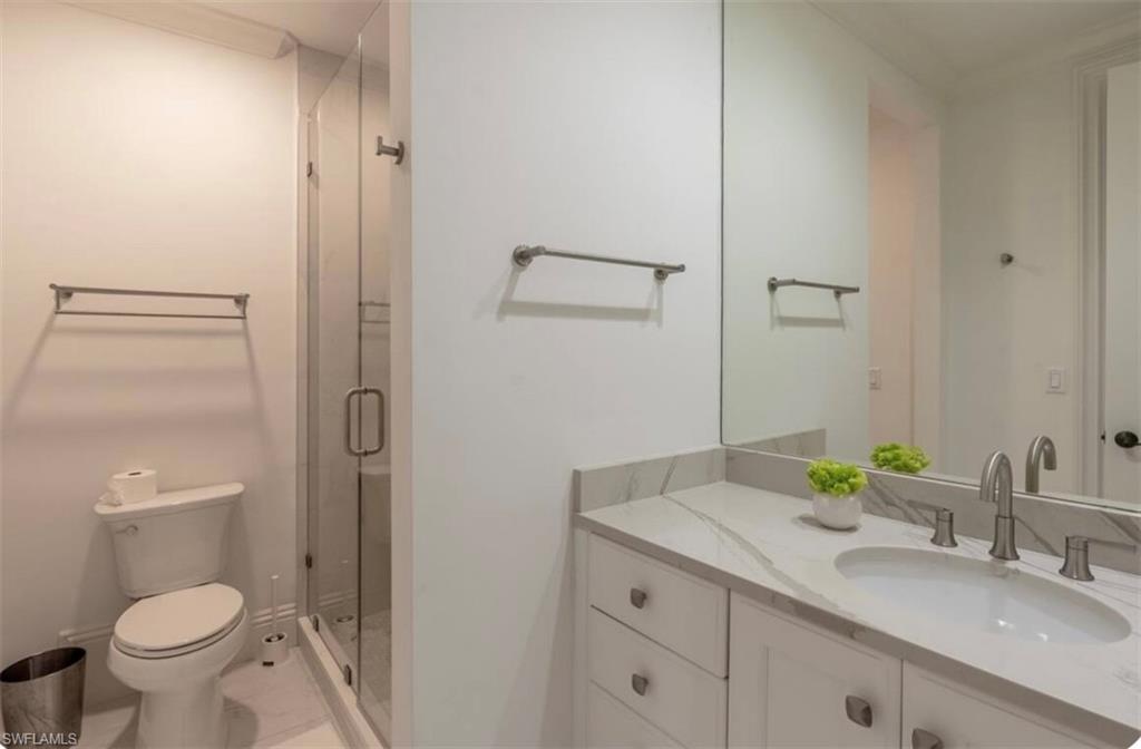 428 Rudder Road Naples, FL 34102 - Photo 17 of 47 Full bath featuring vanity and a shower stall