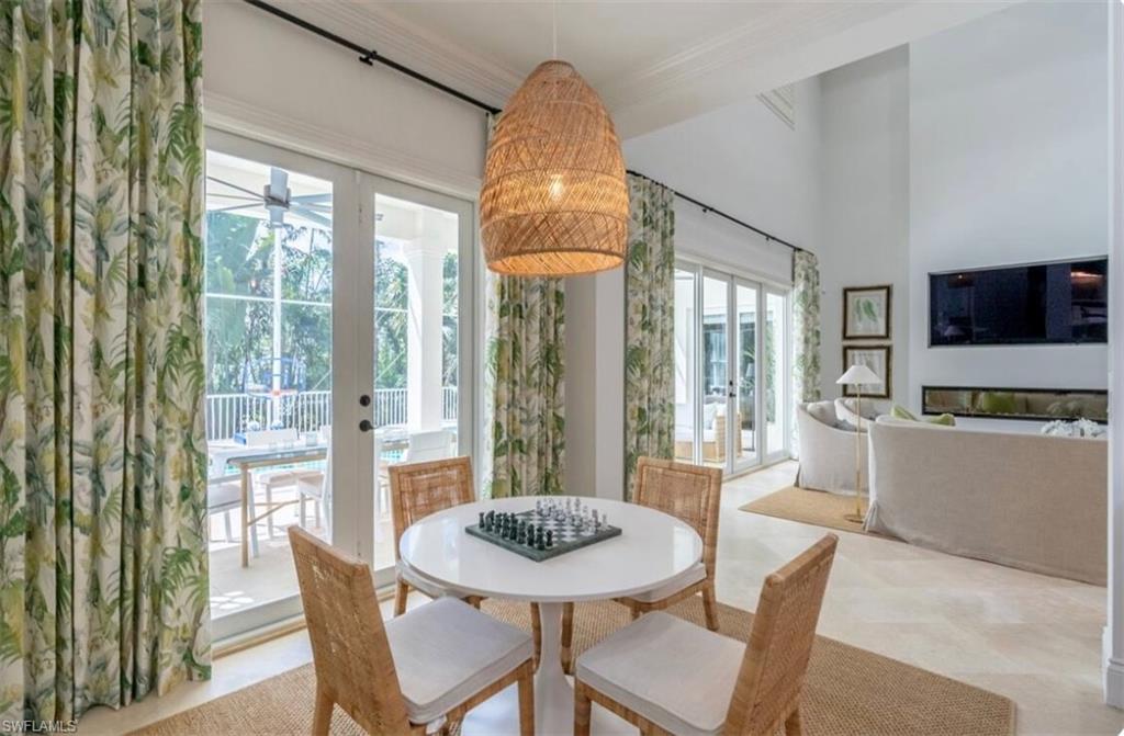 428 Rudder Road Naples, FL 34102 - Photo 40 of 47 Dining space with french doors and crown molding